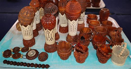 A group of 19th century coquilla nut and vegetable ivory engine turned containers, stands, miniature baskets, napkin rings and jeweller